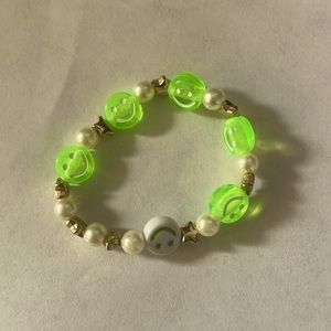 The color is green and white and the size is a small /medium